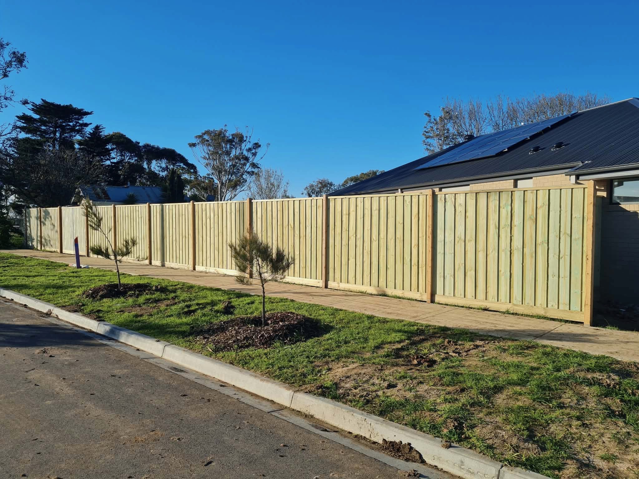 New timber boundary fencing beside an Armstrong Creek home